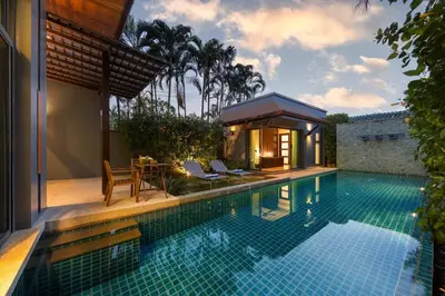 a swimming pool next to a house with a villa at Villa Hahana Private Pool Near Nai Harn Beach in Rawai Beach