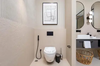 a bathroom with a toilet and a sink at VILLA MIOS Private Pool 3 min Nai Harn Beach in Nai Harn Beach