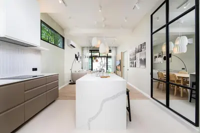 a kitchen with a white counter and a dining room at VILLA MIOS Private Pool 3 min Nai Harn Beach in Nai Harn Beach