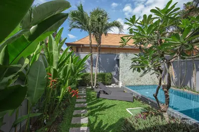 a backyard with a swimming pool and a resort at VILLA JAVA Private Pool Nai Harn Beach in Rawai Beach