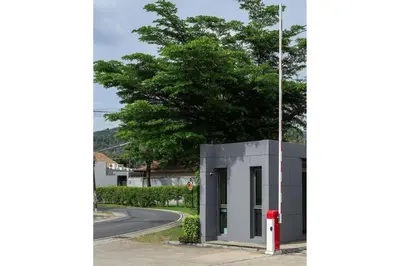 a building with a red fire hydrant next to a street at VILLA JAVA Private Pool Nai Harn Beach in Rawai Beach