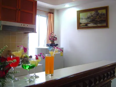 a kitchen counter with some drinks on it at Sunset Mansion in Patong Beach
