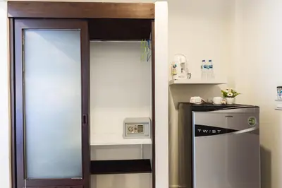 a door leading into a room with a counter at Kasemsuk Hotel Karon in Karon Beach