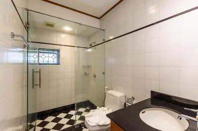 a bathroom with a sink and a shower and a toilet at Amber Pool Villa Your private slice of paradise in Rawai Beach