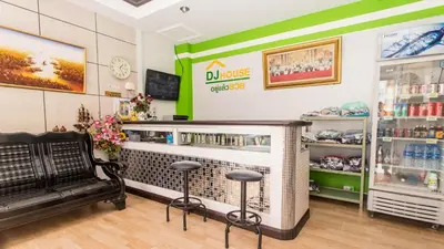 a store with a counter with stools in a room at DJ House ดีเจ เฮ้าท์ป่าตอง in Patong Beach