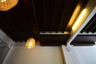 a room with a ceiling and a light fixture at 99 Oldtown Boutique Guesthouse SHA EXTRA PLUS in Phuket Town