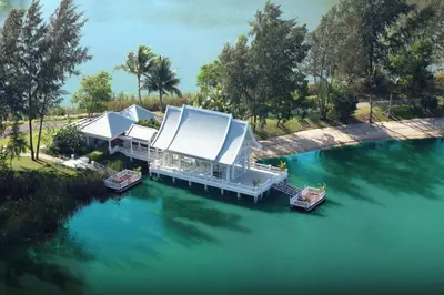 an aerial view of a house on the water at Angsana Laguna Phuket in Bang Tao Beach