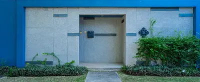 a building with a door in the side of it at Villa 1 Bedroom with private pool at Wings Pasak in Bang Tao Beach