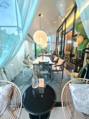a dining room with a table and chairs at Villa 1 Bedroom with private pool at Wings Pasak in Bang Tao Beach
