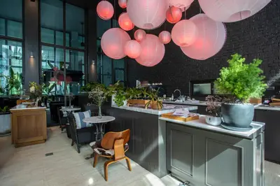 a restaurant with pink lights hanging from the ceiling at Saturdays Residence - 2 Bedrooms Service Apartment in Rawai Beach