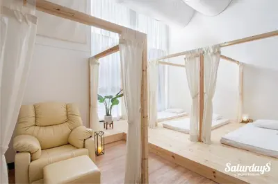 a living room with a chair and a bed at Saturdays Residence - 2 Bedrooms Service Apartment in Rawai Beach