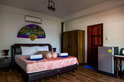 a bedroom with a large bed with at Yao Yai Beach Resort in Ko Yao Yai