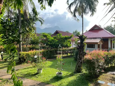 a house with a garden with plants in the yard at Krabi Discovery Resort in Tha Lane Bay