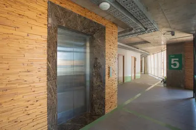 a hallway with a large glass door in a building at EcoLoft Hotel - SHA Plus in Phuket Town