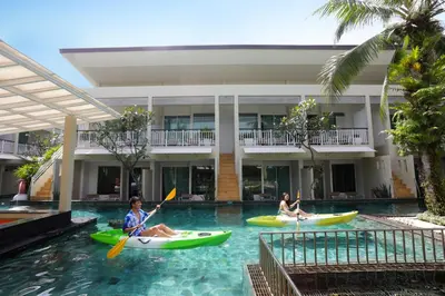 a group of people kayaking in a swimming pool in a hotel at A2 Pool Resort - SHA Plus in Phuket Town