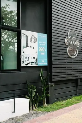 a sign on a black building with a skull on it at Blu Monkey Phi Phi Island in Phi Phi Don