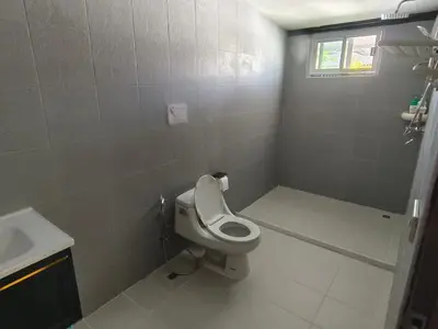 a white bathroom with a toilet and a sink at Thai family rawai Swimming pool villa Hotel in Rawai Beach
