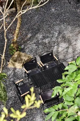 an overhead view of three black benches on the ground at Thai Modern Resort & Spa 
