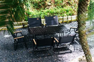 two black chairs and a table and two chairs at Thai Modern Resort & Spa 