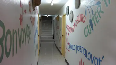 a hallway with graffiti on the walls of a room at Similan Hotel in Bang Tao Beach