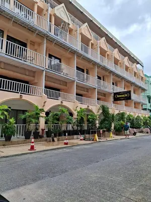 an empty street in front of a large building at Boomerang Inn in Patong Beach