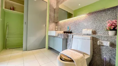 a bathroom with a toilet and a sink at Great view in 81sqm top floor space in Kamala in Kamala Beach