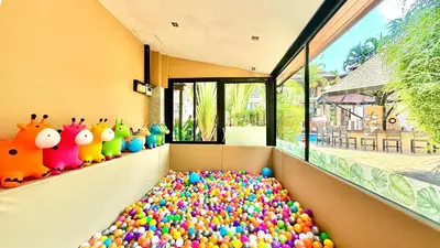 a large pile of balls in a room with a window at Princess Kamala Beachfront Hotel - SHA Extra Plus in Kamala Beach