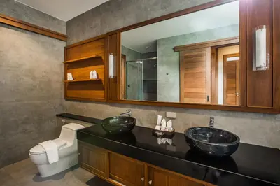 a bathroom with two sinks and a toilet at Villa Palavee (B1) in Ao Nang Beach