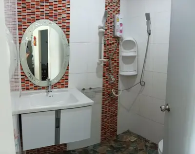 a bathroom with a sink and a mirror at 3BR Villa near Laguna beach in Bang Tao Beach
