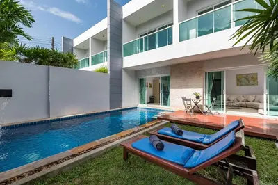 a swimming pool in the backyard of a house at Trixie Town House 2 With Private Pool in Rawai Beach
