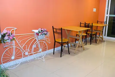 a bike is attached to a wall in a restaurant at Raya Rawai Place in Rawai Beach
