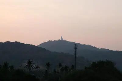 a hill with a tower on top of a mountain at Raya Rawai Place in Rawai Beach