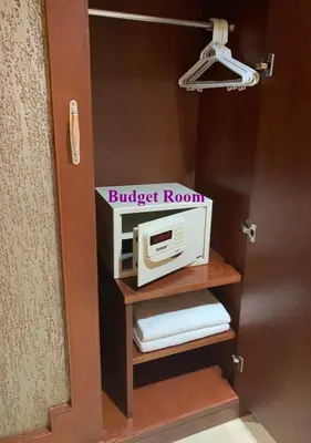 a microwave on a shelf in a room at Le Tanjong House in Patong Beach
