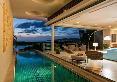 a house with a swimming pool and a patio at The heights Penthouse Ocean view A11 Near Kata Beach in Kata Beach