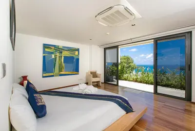 a bedroom with a bed and a large window at The heights Penthouse Ocean view A11 Near Kata Beach in Kata Beach