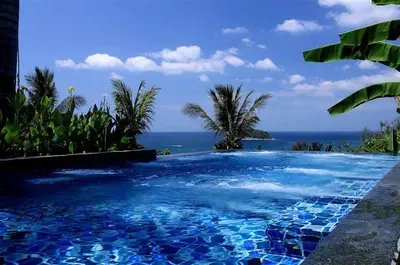 a swimming pool with the ocean in the background at The heights Kata seaview C1 near Kata Beach in Kata Beach