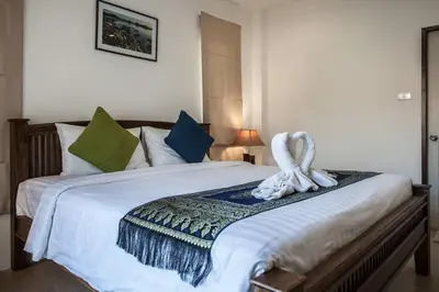 a bedroom with a large bed with white sheets at Poonsiri Private Pool Villa Aonang in Ao Nang Beach