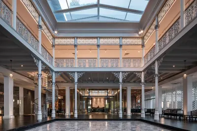 a view of the lobby of a building with a glass ceiling at Ramada Plaza by Wyndham Chao Fah Phuket in Phuket Town