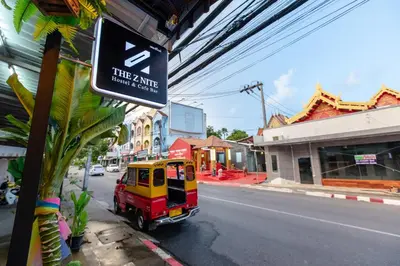 a small truck parked on the side of a street at The Z Nite Hostel in Phuket Town