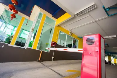 a red object in front of a building at Central Residences in Phuket Town