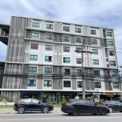 two cars parked in front of a building at Zcape at Bangtao in Bang Tao Beach