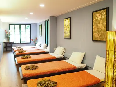a row of beds lined up in a room at Aonang Buri Resort in Ao Nang Beach