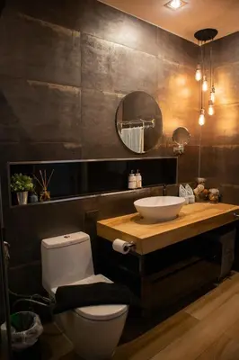 a bathroom with a white toilet and a sink at Sunset Bliss in Klong Muang Beach