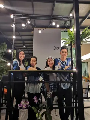 a group of people standing in front of a mirror at iNest Poshtel in Kata Beach