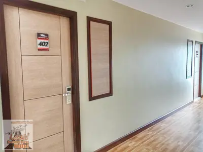 an empty room with a door and a mirror at Louis' Runway View Hotel - SHA Extra Plus in Nai Yang Beach