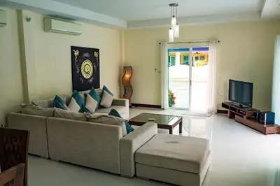 a living room with a couch and a tv at Villa Tanya, 3 Bed with Private Pool and Jacuzzi in Rawai Beach