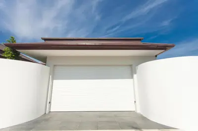 a white garage door with a brown roof on top at Spacious 4 Bedrooms Private Pool Villa in Phuket in Rawai Beach