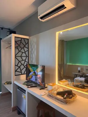 a room with a desk with a large mirror at Resting Place Ko Yao Yai in Ko Yao Yai