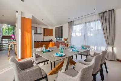 a dining room with a table and chairs at Villa Palavee (A2) in Ao Nang Beach