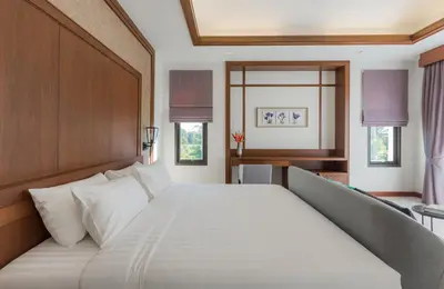 a large white bed in a room with windows at Villa Palavee (A2) in Ao Nang Beach